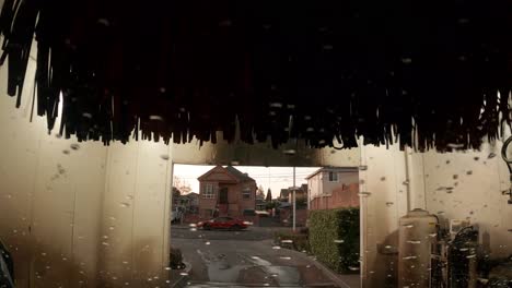 sitting inside of a running automatic car wash.