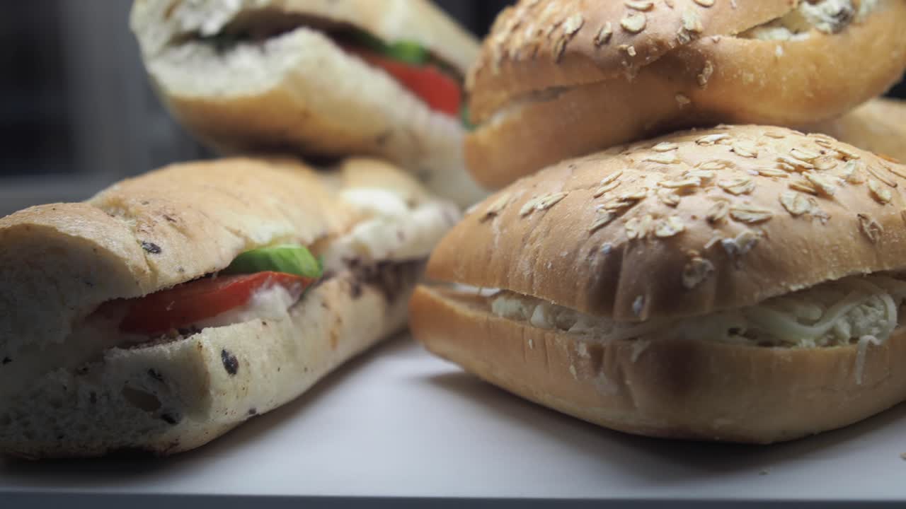 Sandwiches with tomatoes, cheese and vegetables