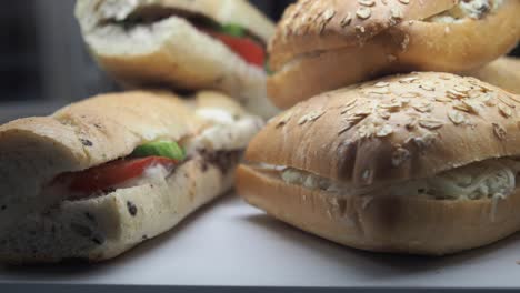 sandwiches with tomatoes, cheese and vegetables