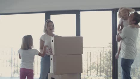 parents and two girls celebrating moving into new apartment