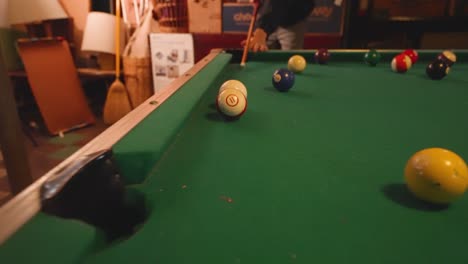 reverse track as cue strikes a stripped ball