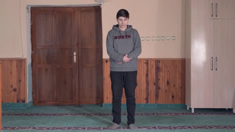 muslim man is praying mosque