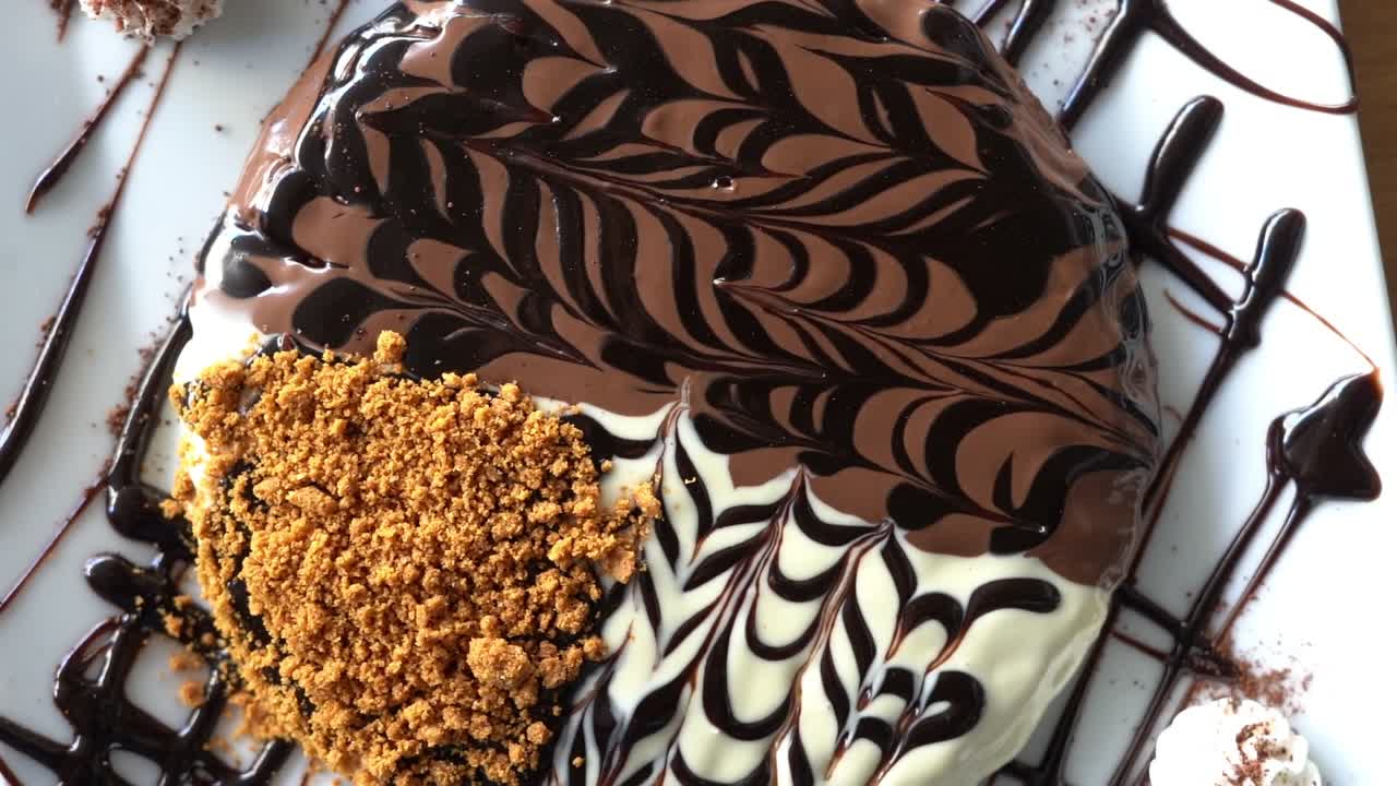 A view of a cake with sweets, close up shot, high angle shot