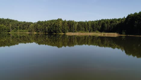 Drone-fly-above-Kashubian-Lake-in-Pomeranian-Lake-District-Poland