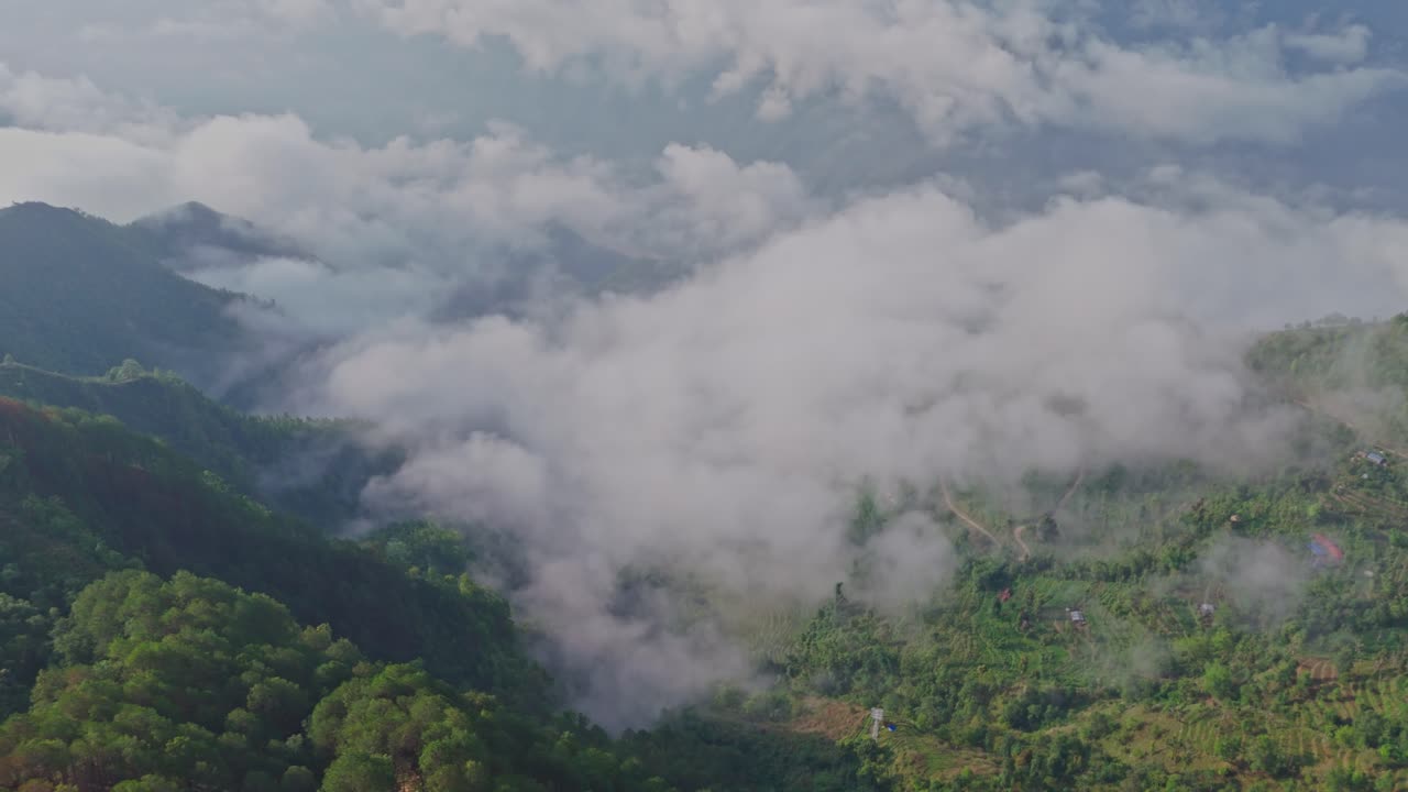 This aerial video shows Manakamana Hill in Gorkha, Nepal, a spiritual and scenic site known for its Hindu temple, panoramic mountain views, and the cable car that connects pilgrims to the hilltop.