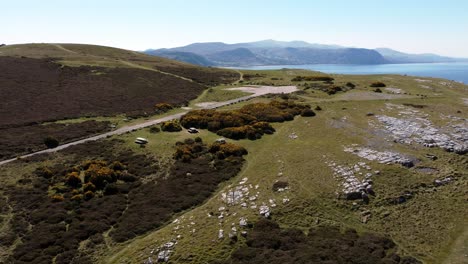 sunny great orme mountain sea view north wales aerial coastal island moorland landscape high orbit left