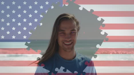 Jigsaw-puzzle-over-american-flag-against-portrait-of-caucasian-man-smiling-at-the-beach