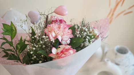 beautiful pink and white carnation bouquet with hearts