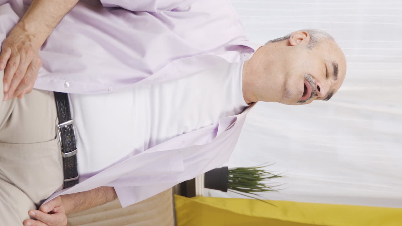 Vertical video of The old man who doesn't feel well.