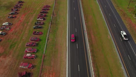 Overtake-Shot-Of-Old-Vintage-Cars-Buried-Near-Highway