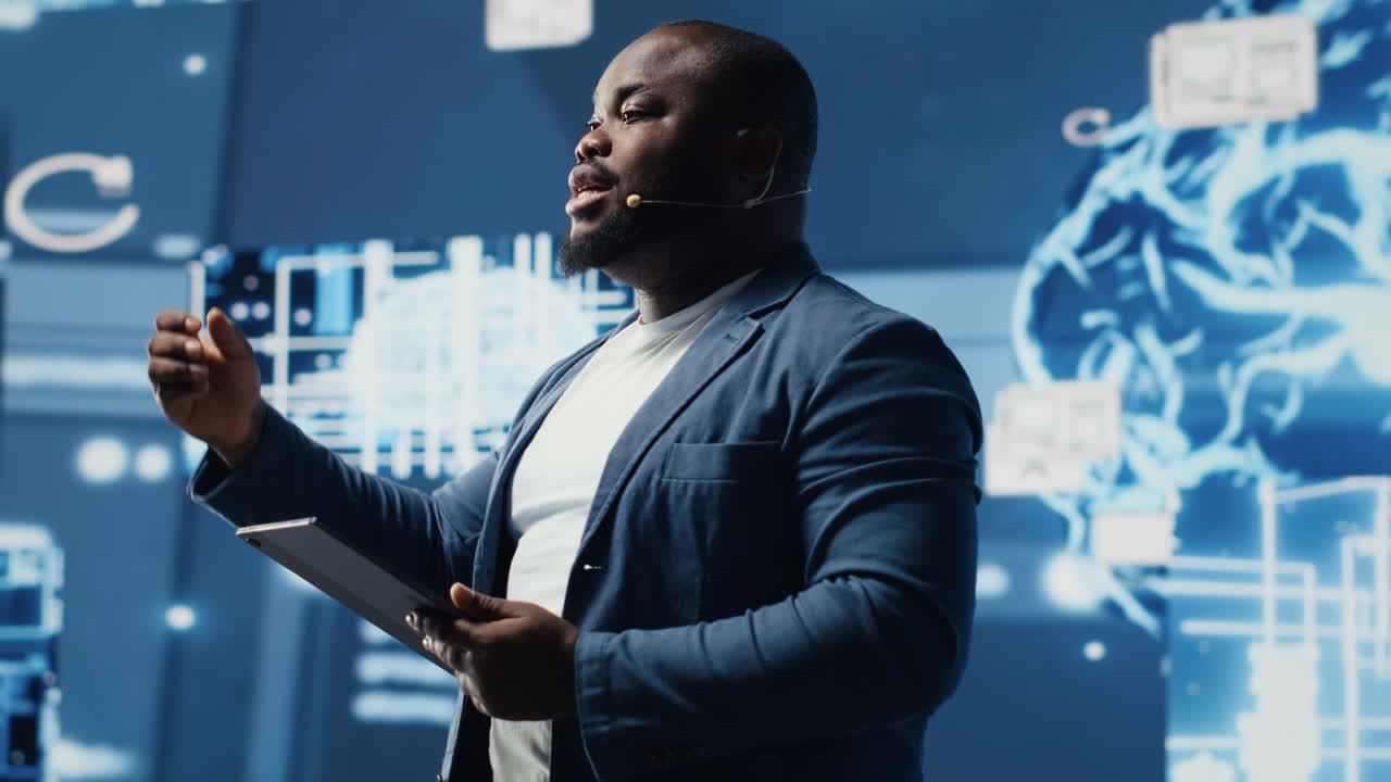 Black public speaker host presenting AI neural networks at live event
