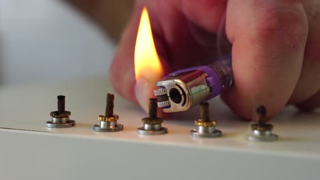 therapist performing moxibustion procedure at health center. moxibustion is a thermal effect on biologically active points located across the entire surface of the human body