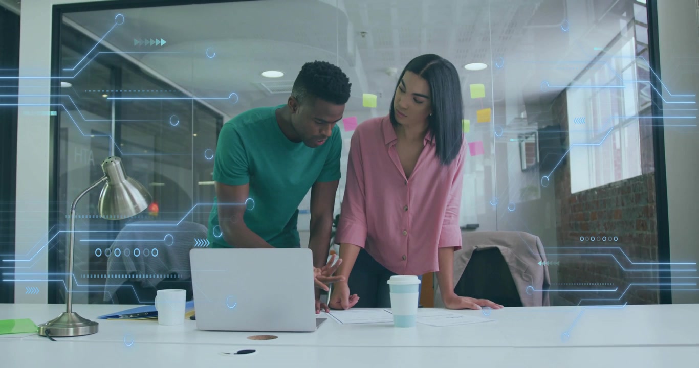 Coworkers leaning forward and pointing at file with animated highlight showing business details