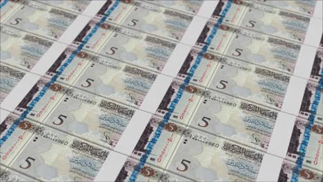 5 libyan dinar banknotes printed by a money press