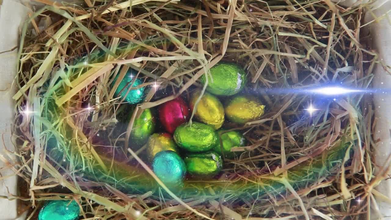 Animation of colorful eggs on dry hay