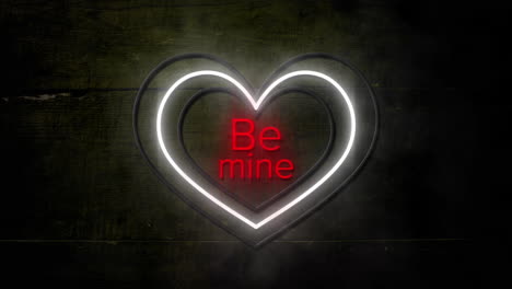 animation of words be mine in red with white and yellow concentric neon hearts flashing on dark wood