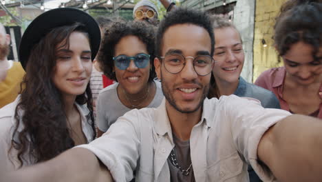 friends taking a selfie at a summer gathering