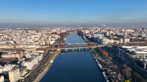 sunny paris skies: seine, île de la jatte, la défense, and a picturesque barge.