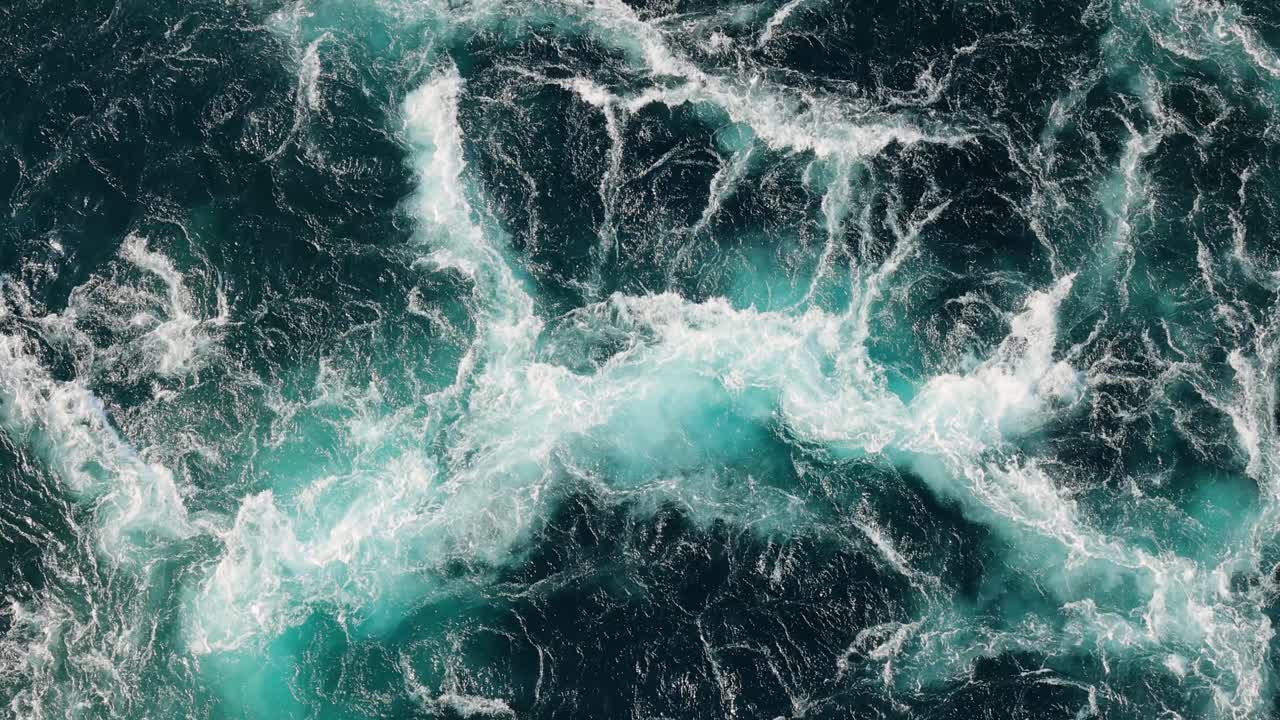 Blue waves of water of the river and the sea meet each other during high tide and low tide.