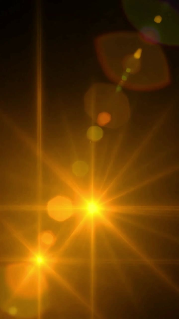 Bagliori di luce dorata astratti ed effetto bokeh su sfondo nero