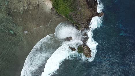 bird's eye rotating shot over the rock island on siargao island