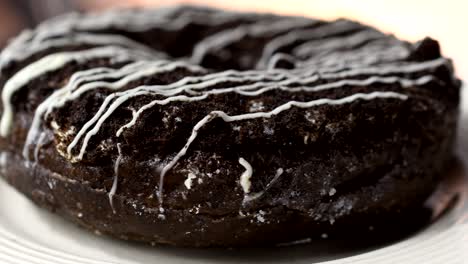 chocolate crunch doughnut turning. delicious sweet cocoa donut rotating