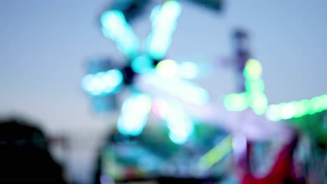 blurred lights of a spinning amusement park ride