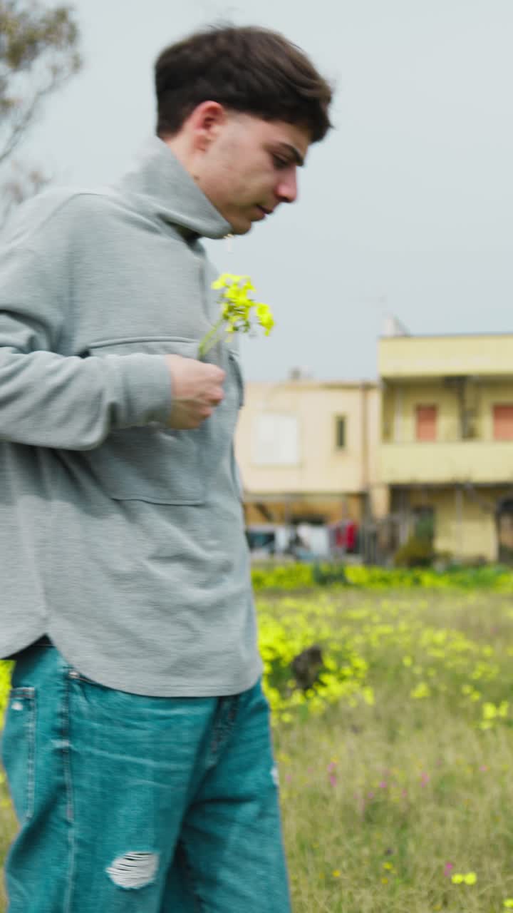 Man Putting Yellow Flowers In The Shirt Pocket