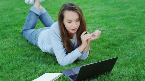 Woman-student-using-laptop-computer-for-study-online-in-college-campus