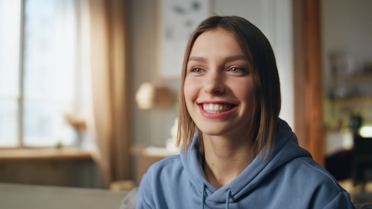 Woman watching TV and celebrating