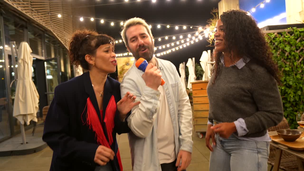 Friends having fun singing karaoke