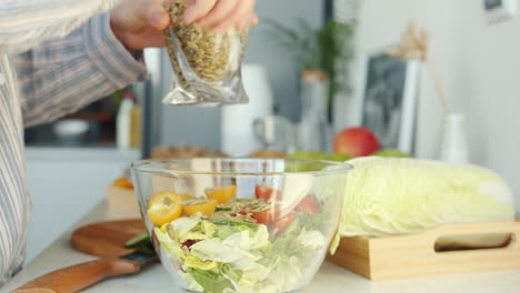 preparing a salad with sunflower seeds