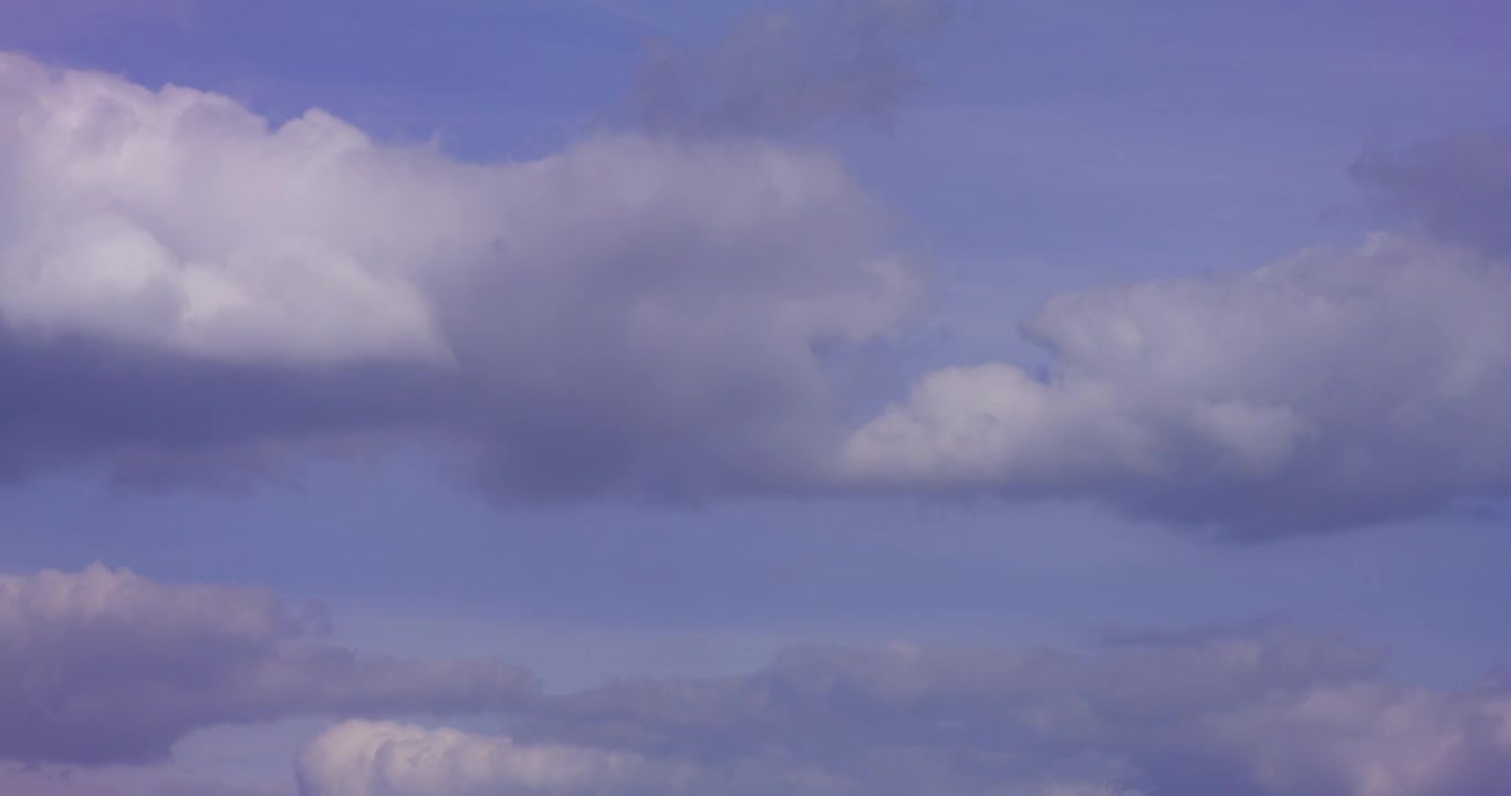 Dynamic Cloudscape with a Bird Flying Across the Blue Sky
