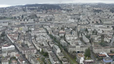 Drone-Aerial-of-the-beautiful-swiss-city-center-of-lausanne-located-on-the-lake-geneva-in-Switzerland-during-winter,-Europe