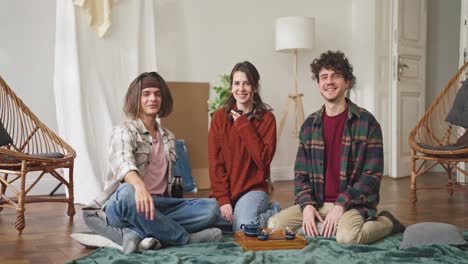 friends enjoying tea in a cozy living room