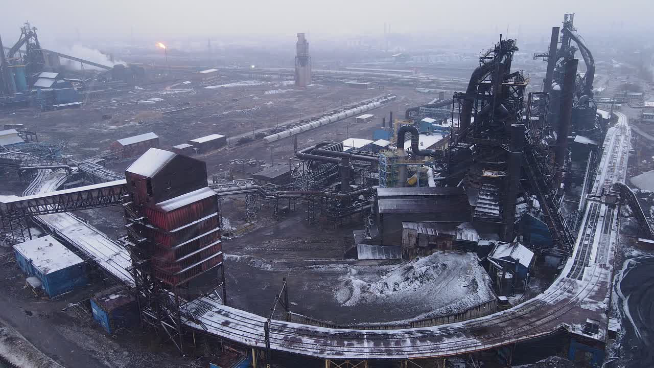Zug Island steel mill in Detroit, USA with snow-dusted blast furnaces and train tracks
