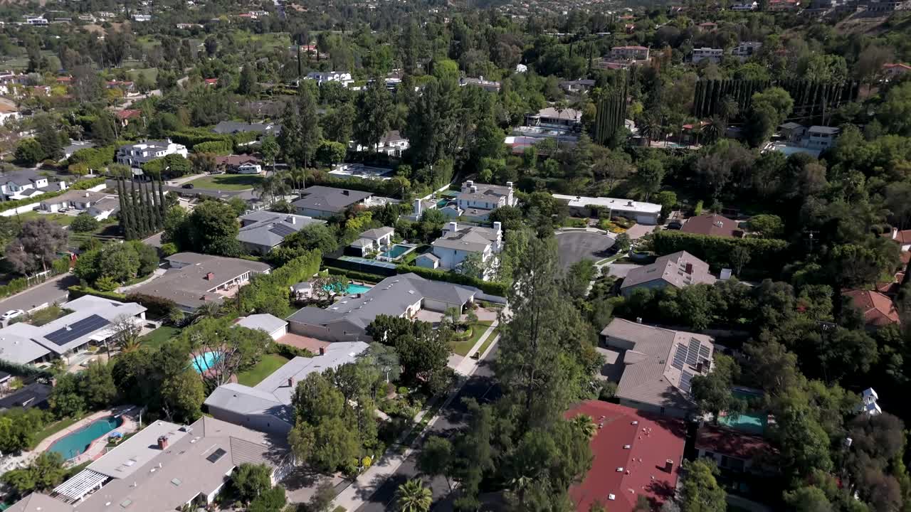 Woodland Hills and Tarzana neighborhoods in San Fernando Valley of Los Angeles - aerial flyover of the residential area