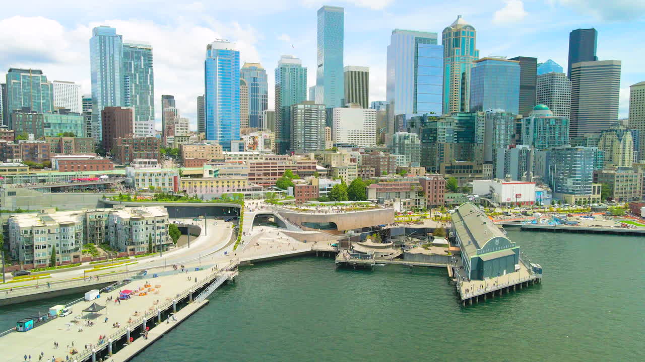 Revealing Drone shot Seattle Downtown, Seattle Waterfront Pier 62 intro and establishing aerial shot