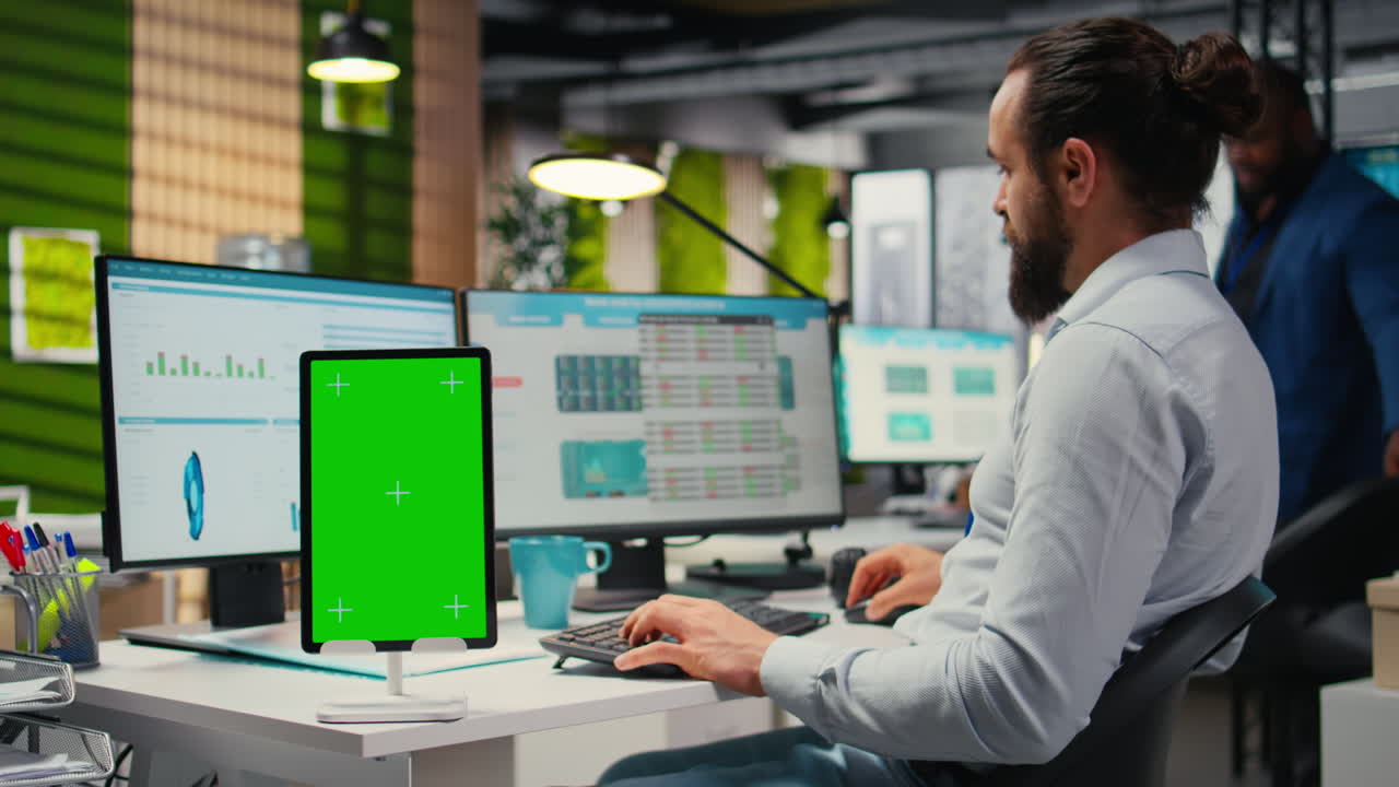 Vertical Video Business consultant examining forecasts with chroma key on tablet