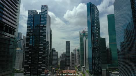 day time flight over singapore city downtown famous market street aerial panorama 4k