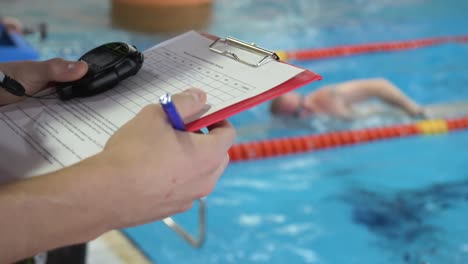 swimming coach recording times