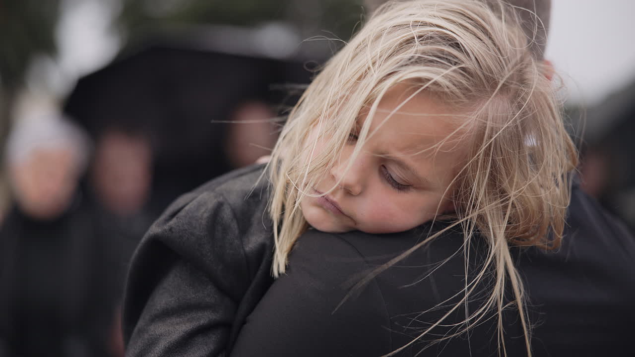 Sad, sleeping and a child with father at a funeral