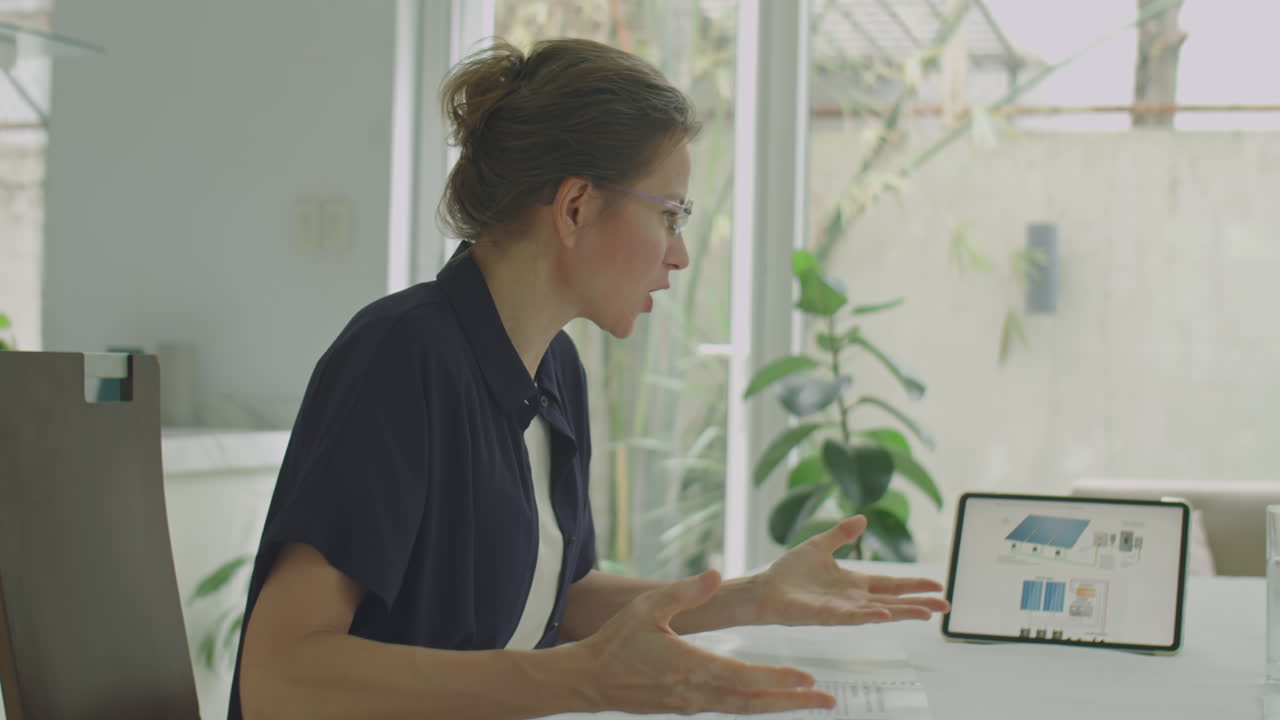 Businesswoman and Engineer Discussing Project at Office Meeting