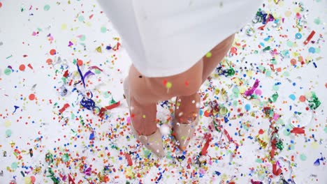 low section of woman playing with confetti 4k