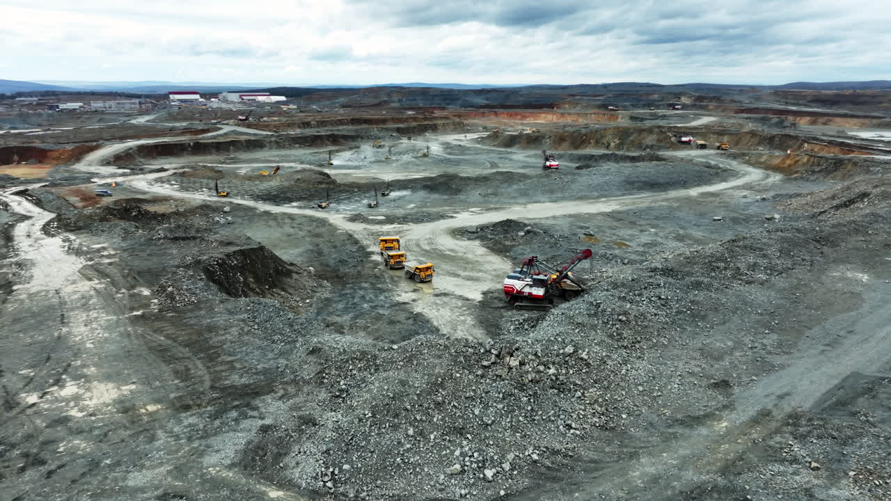 Aerial View of an Open Pit Mine with Heavy Equipment