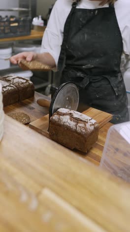 baker slicing bread