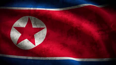 60 fps grunge oscuro bandera de corea del norte con textura de tela en mal estado ondeando, uhd 4k 3d animación de bucle sin costuras