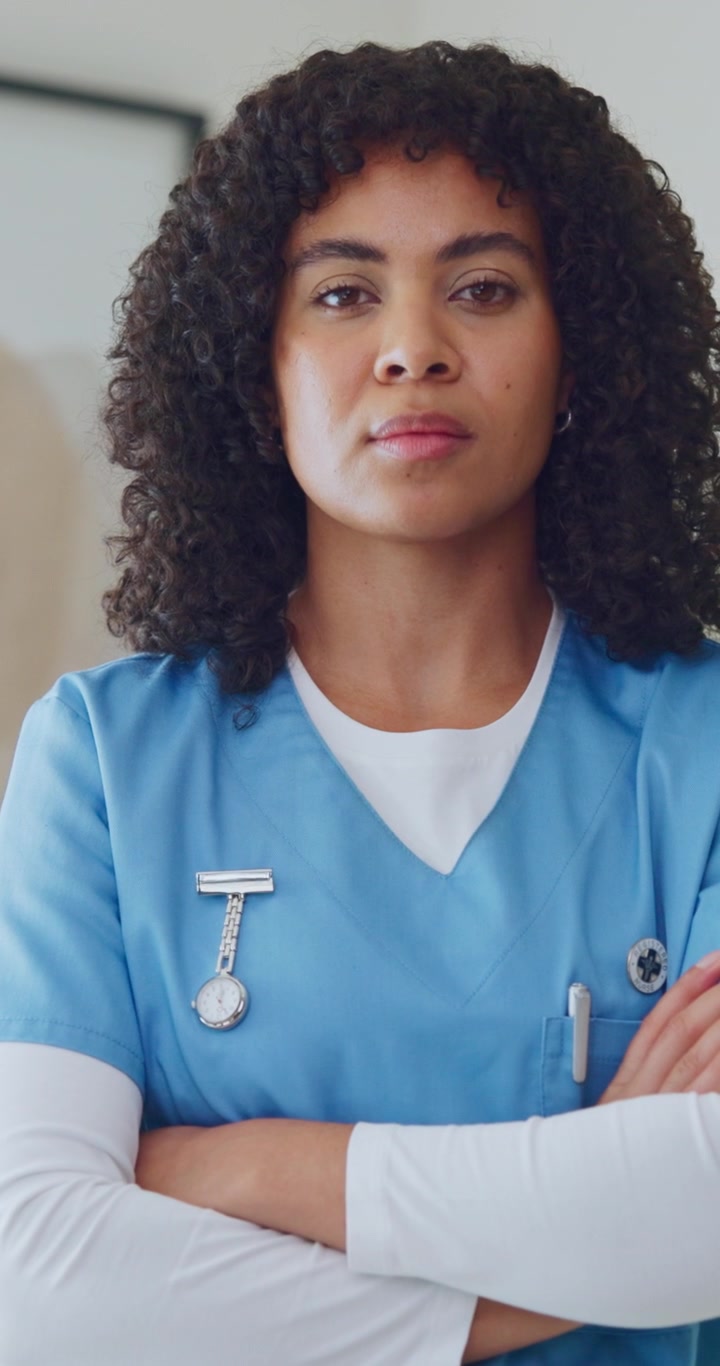 Portrait of a Confident Female Nurse in Blue Scrubs