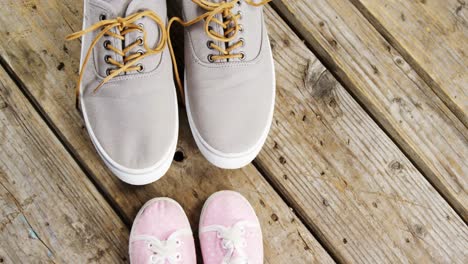 pairs of new shoes on wooden plank