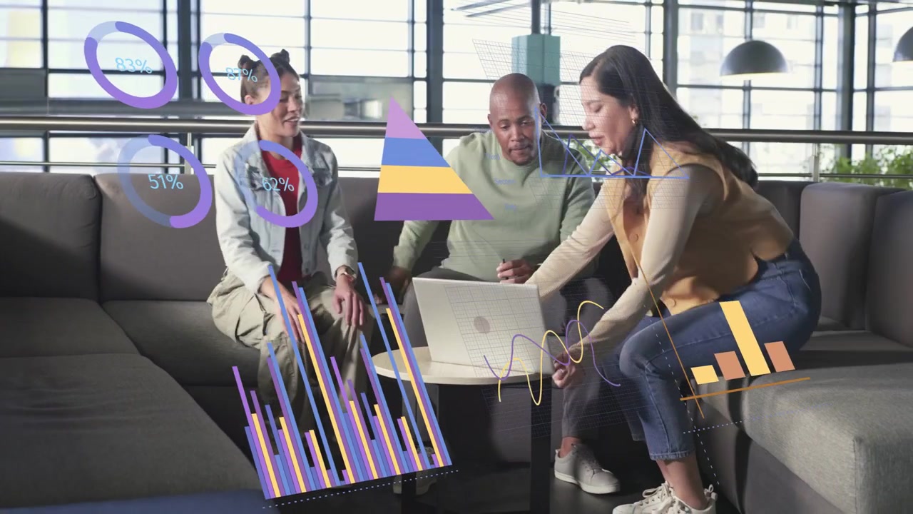 Presenter walking in placing laptop, activating floating bar charts over group for business review